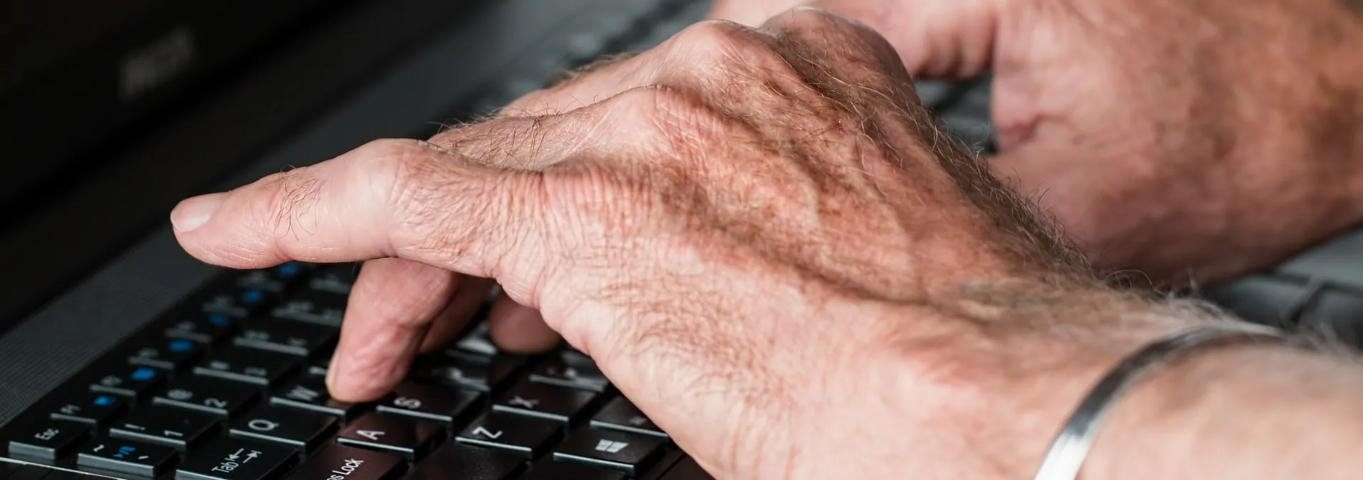 Aged hands typing